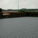 Mechanically fastened cover board installation for commercial roof system in Cincinnati.
