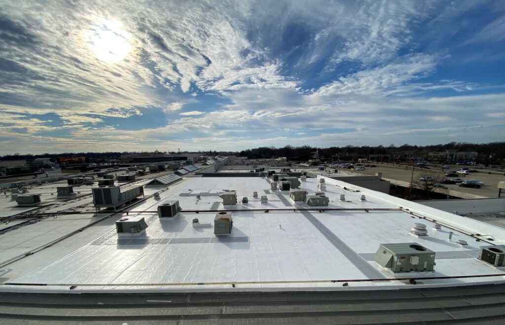 Completed commercial roofing system installed on large building