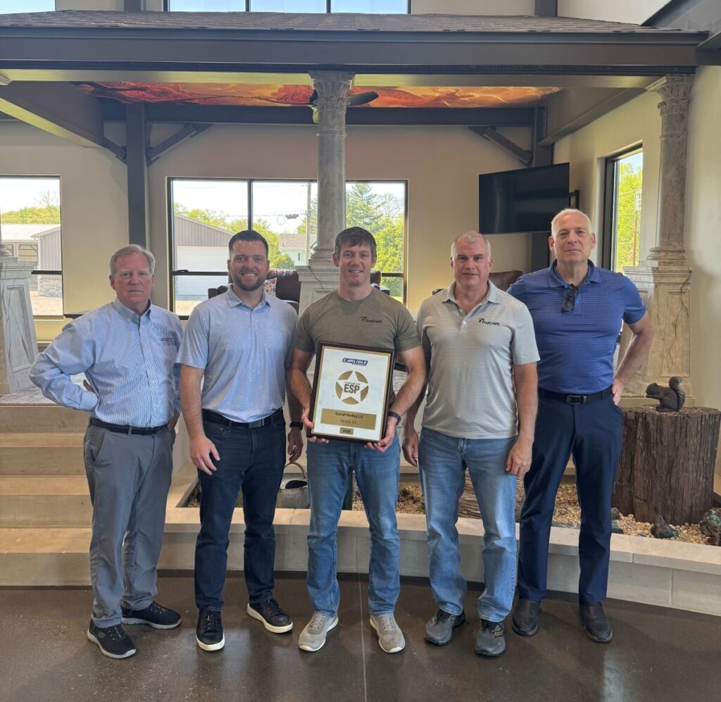 TruCraft Roofing team receiving Carlisle SynTec ESP award for commercial roofing excellence