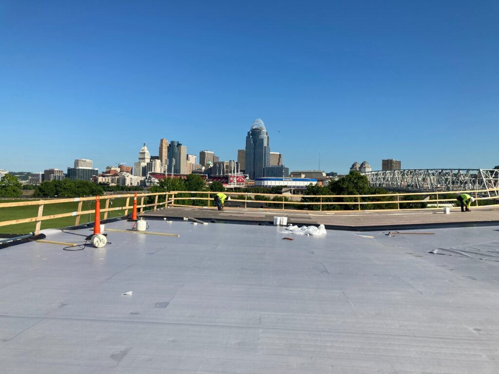 Commercial roofing project overlooking the Cincinnati skyline
