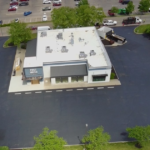 Aerial view of the completed First Watch Restaurant PVC roofing project in Milford, Ohio featuring a fully-adhered low-slope roofing system installed by TruCraft.