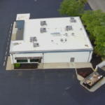 Aerial overview of the First Watch Restaurant PVC roofing project in Milford, Ohio showing the completed low-slope commercial roofing system and surrounding property.