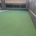 Completed rooftop playground installed above a commercial TPO roofing system at Dayton Children's Behavioral Health in Dayton, Ohio.